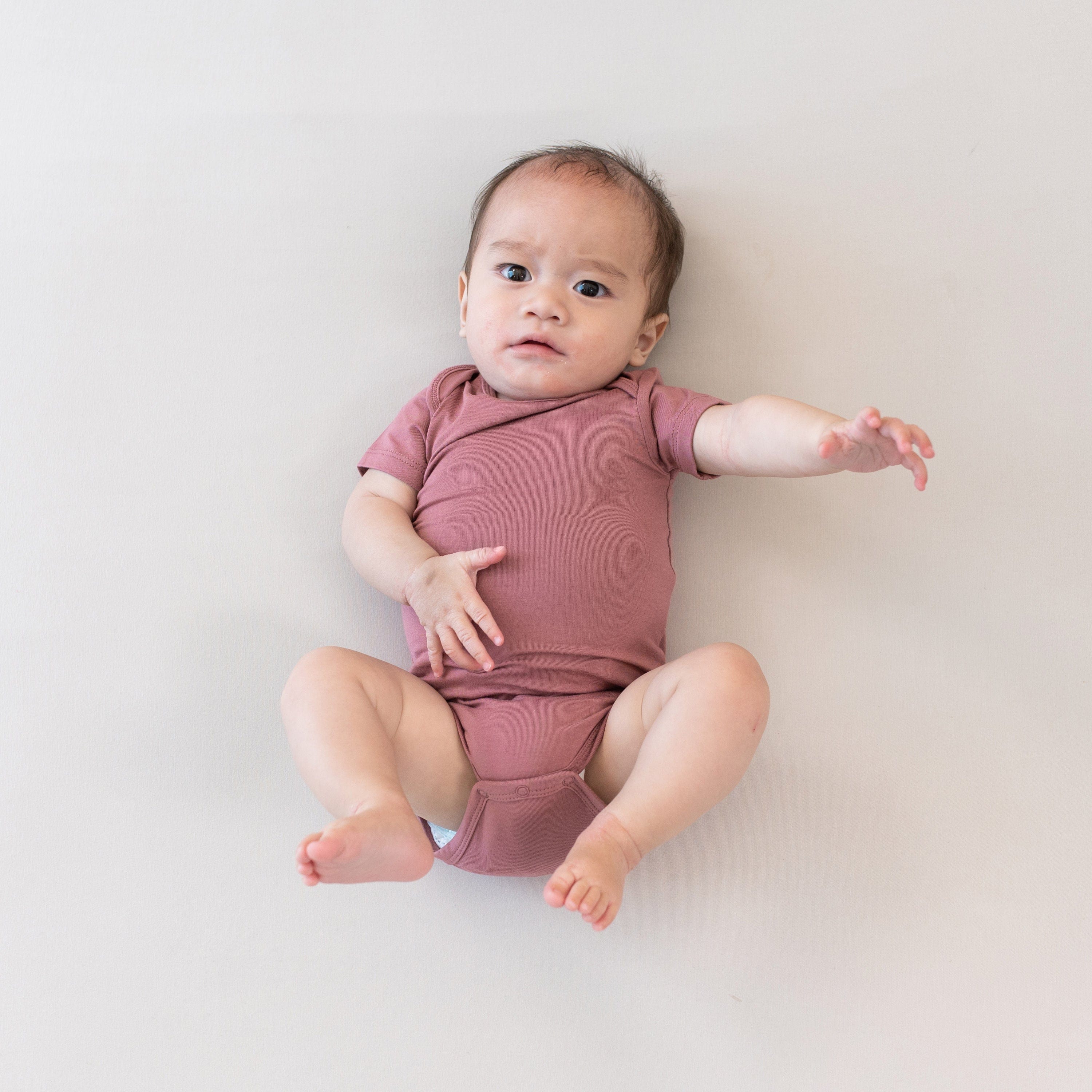 Kyte Baby Short Sleeve Bodysuits Bodysuit in Dusty Rose