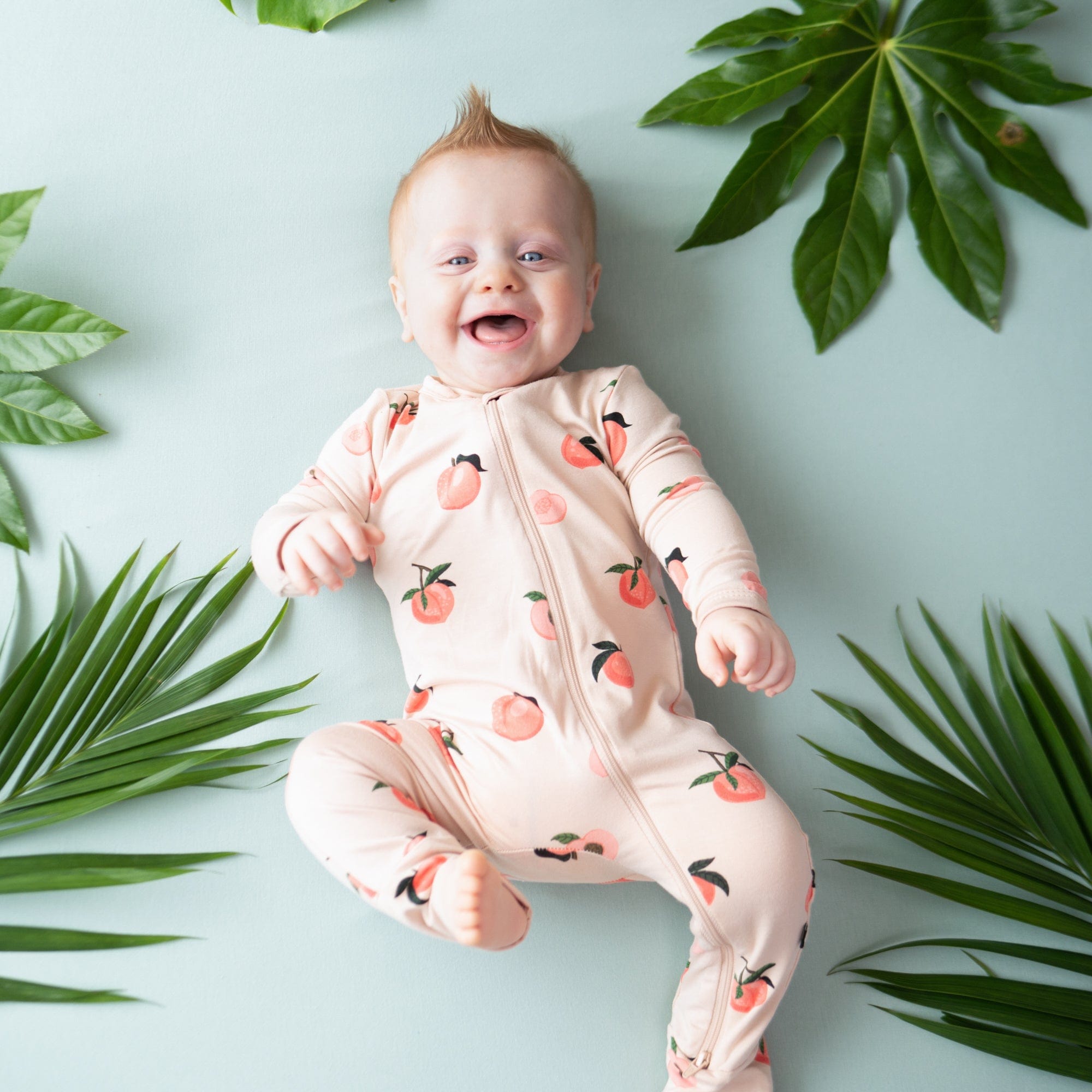 Kyte Baby Zippered Rompers Zippered Romper in Peach