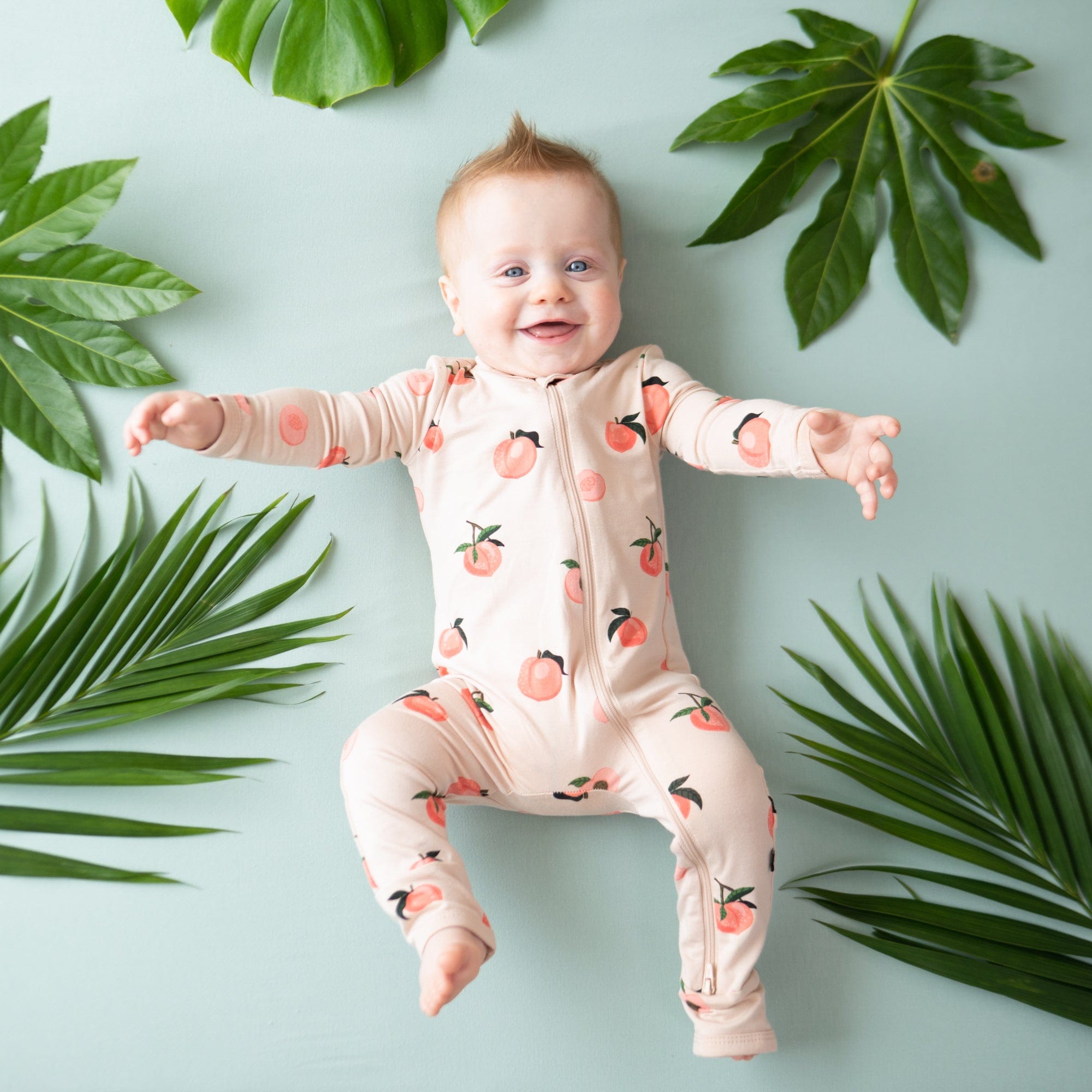 Kyte Baby Zippered Rompers Zippered Romper in Peach